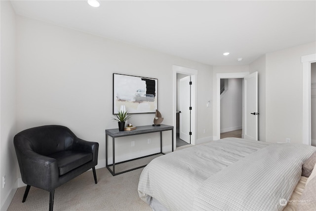 bedroom featuring light colored carpet