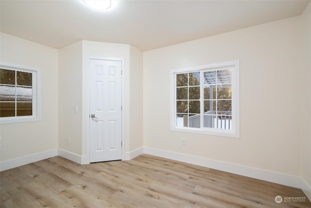 unfurnished room featuring light hardwood / wood-style floors