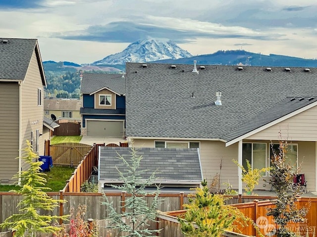 back of house featuring a mountain view