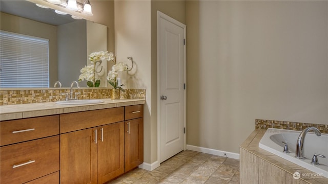 bathroom featuring vanity and decorative backsplash