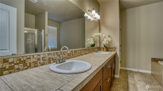 bathroom with tasteful backsplash and vanity