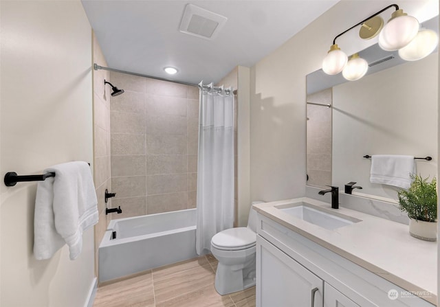 full bathroom featuring vanity, shower / bath combination with curtain, and toilet