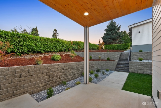 view of patio terrace at dusk