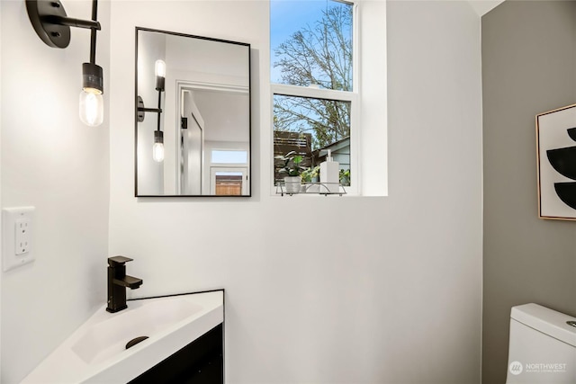 bathroom with vanity and toilet