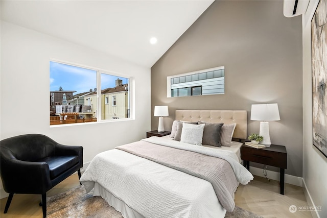 bedroom with an AC wall unit and high vaulted ceiling