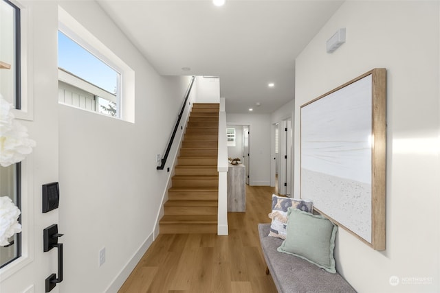 stairway featuring hardwood / wood-style floors