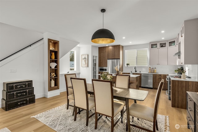 dining area with light hardwood / wood-style floors