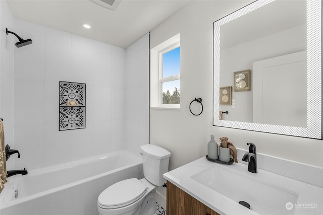 full bathroom with vanity, toilet, and tiled shower / bath combo