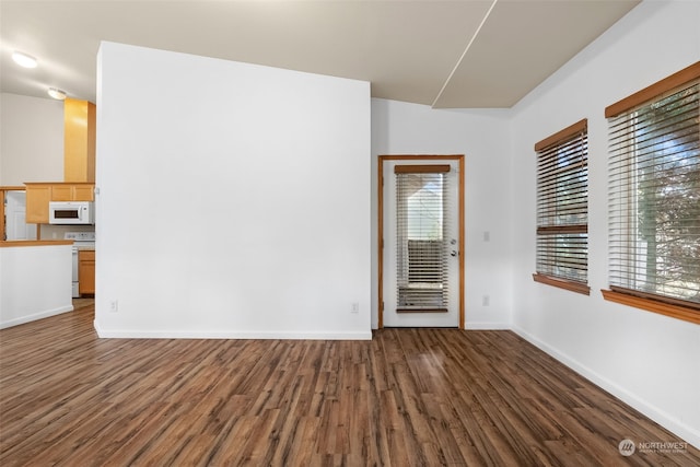 unfurnished room featuring dark hardwood / wood-style floors