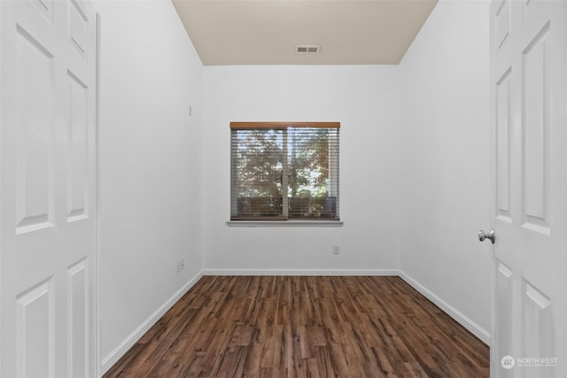 unfurnished room with dark hardwood / wood-style floors