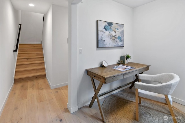 office space with light hardwood / wood-style flooring