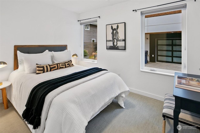 bedroom featuring light colored carpet