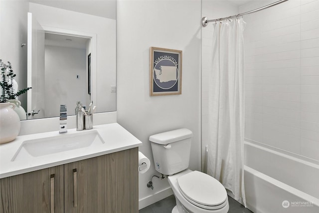 full bathroom with vanity, shower / tub combo, and toilet