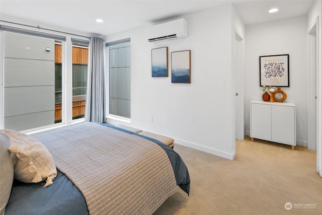 carpeted bedroom with a wall mounted air conditioner