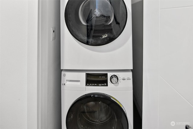 laundry room featuring stacked washer and clothes dryer