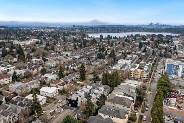 aerial view featuring a water and mountain view