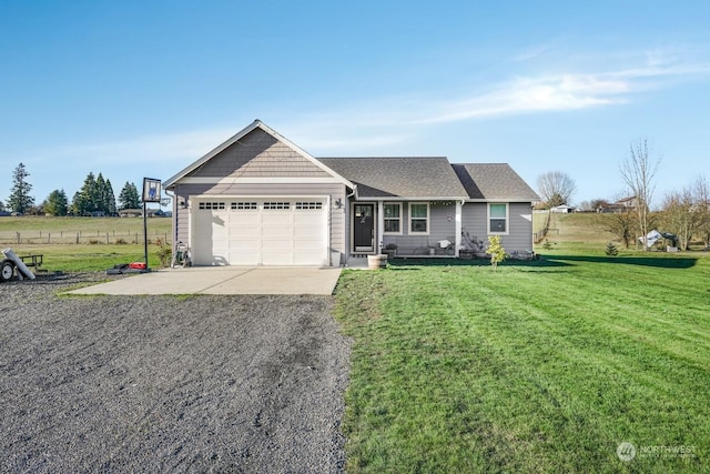 ranch-style home with a garage and a front lawn