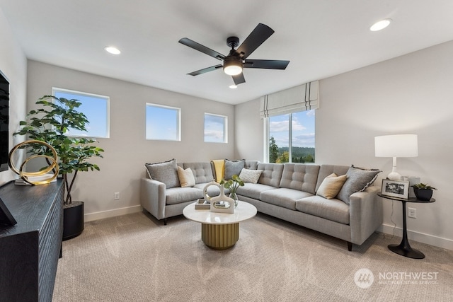 living room featuring light colored carpet and ceiling fan