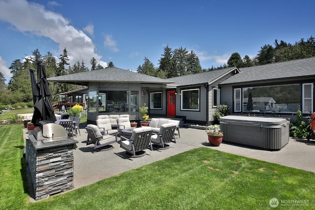 back of property featuring a lawn, a hot tub, roof with shingles, outdoor lounge area, and a patio area