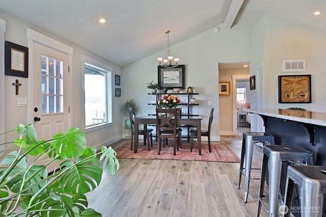 dining area featuring visible vents, baseboards, beam ceiling, light wood-style flooring, and an inviting chandelier