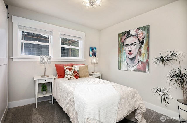 carpeted bedroom featuring baseboards