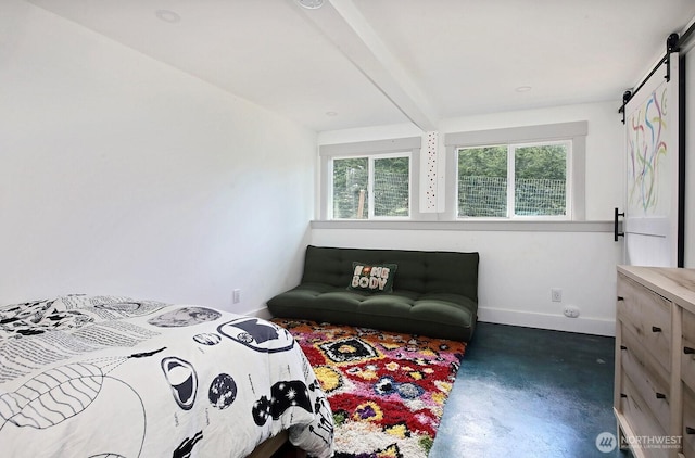 bedroom featuring a barn door, baseboards, concrete flooring, and beam ceiling