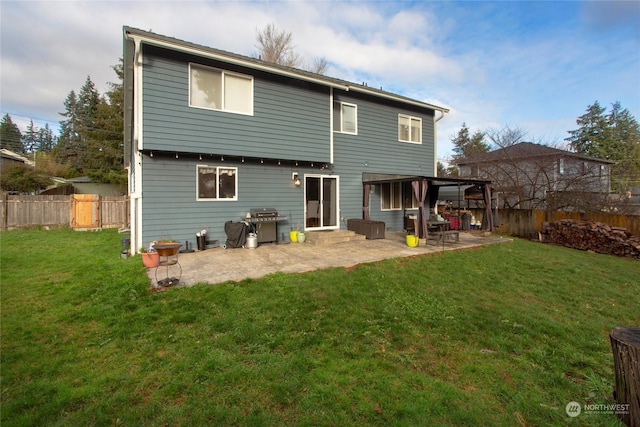 rear view of property featuring a patio and a lawn