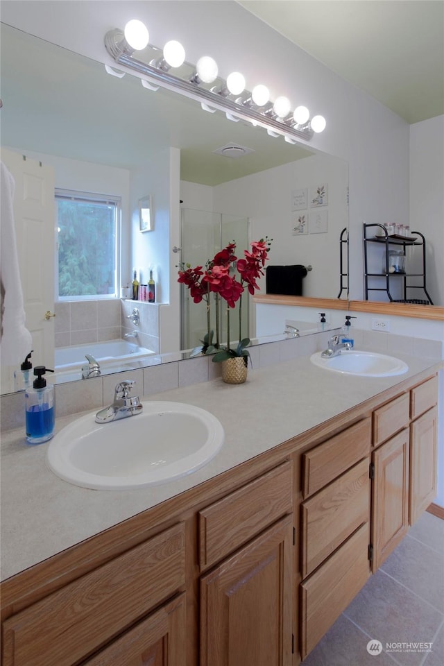 bathroom featuring vanity, separate shower and tub, and tile patterned floors