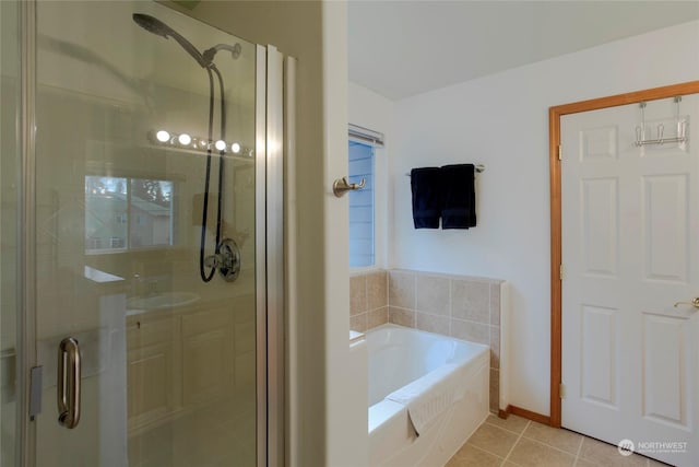 bathroom featuring independent shower and bath and tile patterned flooring