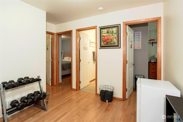 hallway with light wood-type flooring