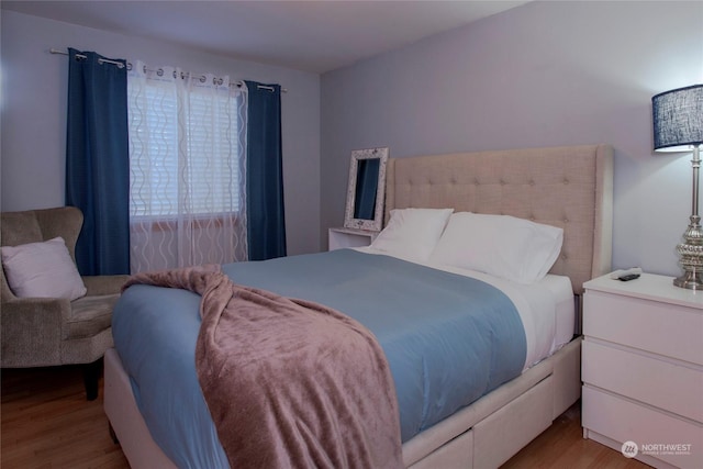 bedroom with light wood-type flooring