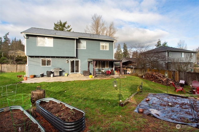 back of property with a patio and a lawn