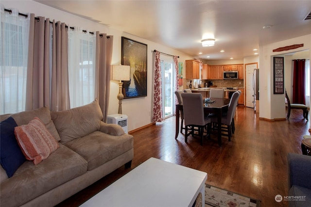 living room featuring dark hardwood / wood-style flooring