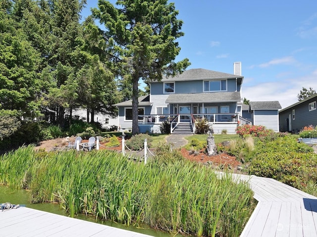 view of front facade with a wooden deck