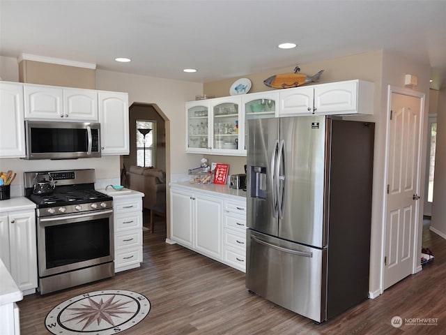 kitchen with white cabinetry, dark hardwood / wood-style flooring, and stainless steel appliances