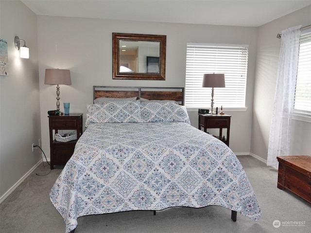 carpeted bedroom with multiple windows