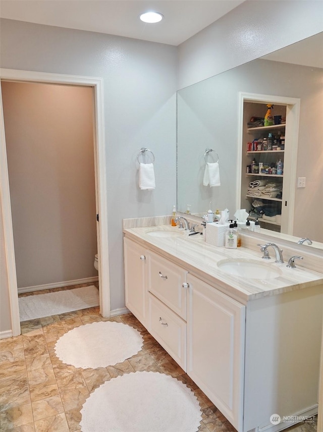 bathroom with vanity and toilet