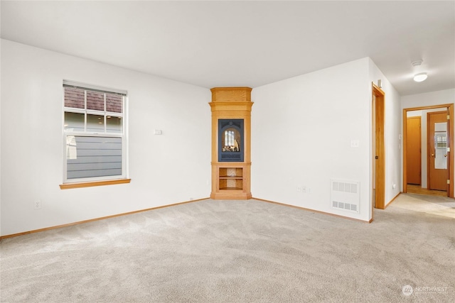 unfurnished living room with light carpet