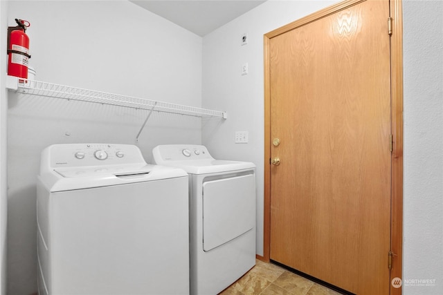 laundry room with independent washer and dryer