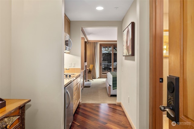 hall with washer / dryer and dark wood-type flooring