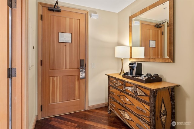 entryway with dark wood-type flooring