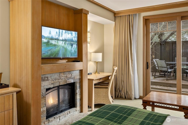 interior space with ornamental molding and a fireplace