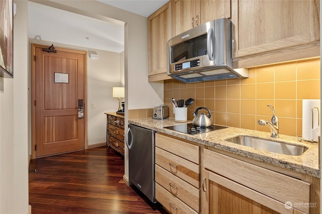 kitchen featuring light brown cabinetry, sink, decorative backsplash, black electric stovetop, and light stone counters