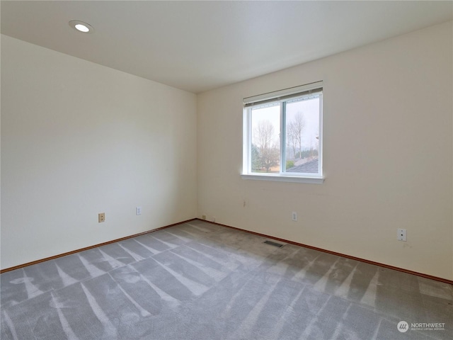 spare room with carpet floors