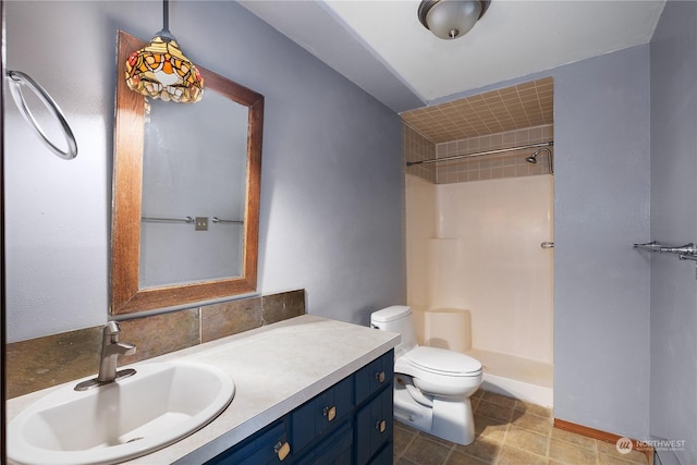 bathroom with vanity, toilet, and walk in shower