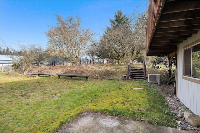 view of yard with central AC unit