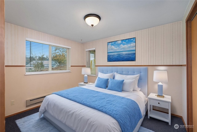 carpeted bedroom featuring a baseboard radiator