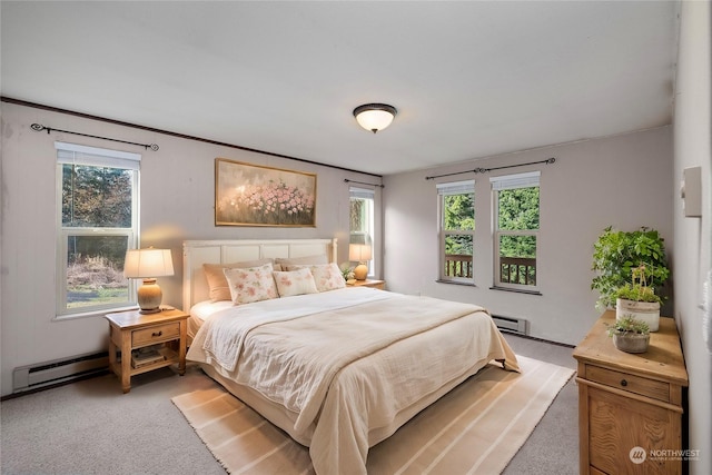 carpeted bedroom with a baseboard heating unit