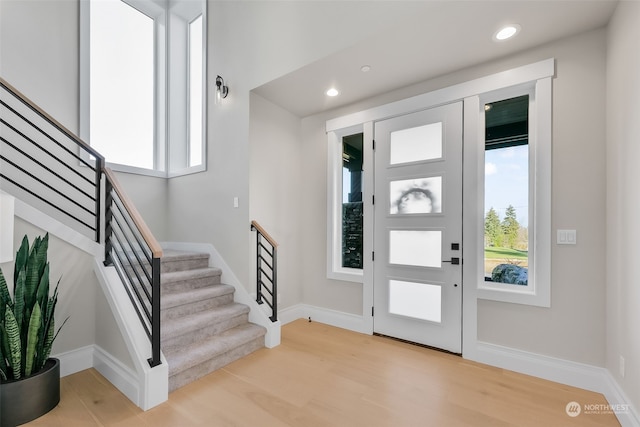 entrance foyer with light hardwood / wood-style flooring