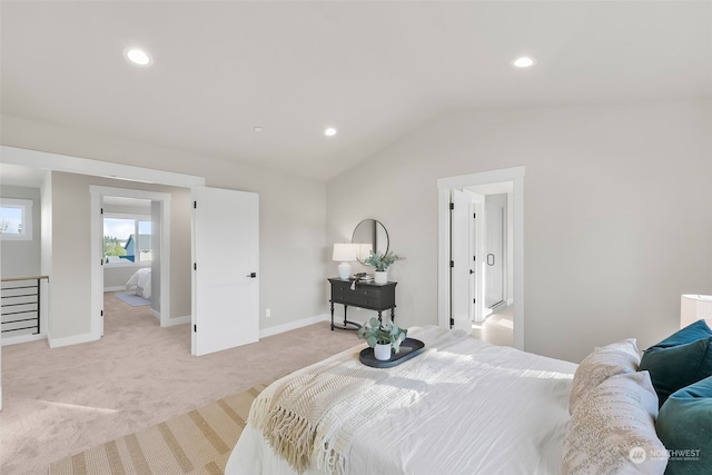 carpeted bedroom featuring lofted ceiling